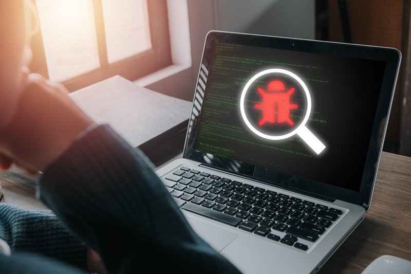 Software development and debugging concept, Person hand using la