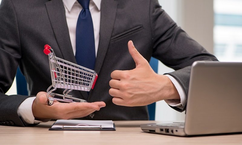 Businesswoman with shopping cart trolley